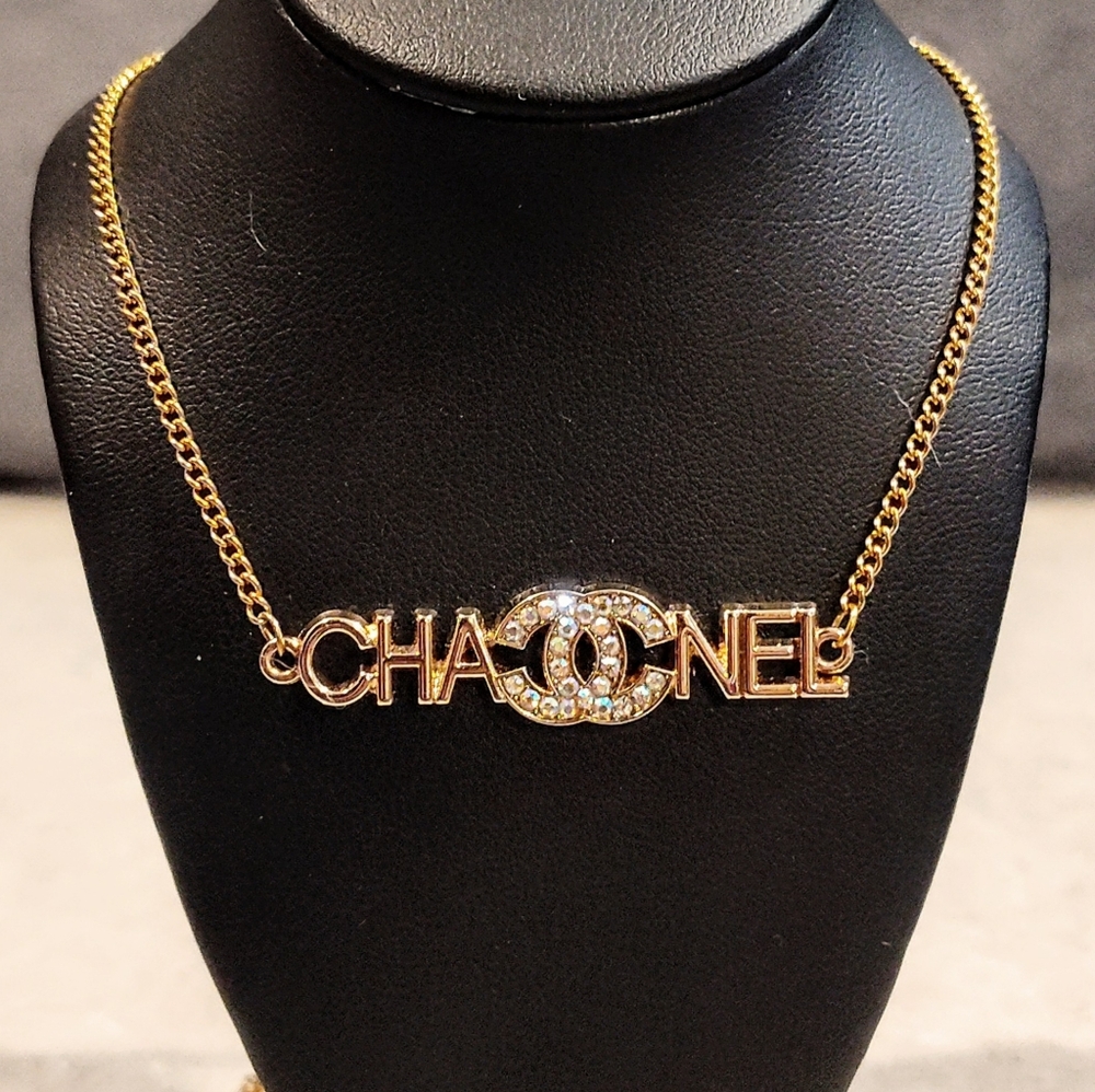 CHANEL CC LOGO 18K GOLD PLATED LOGO PENDANT WITH MULTICOLOR RHINESTONE ACCENTS